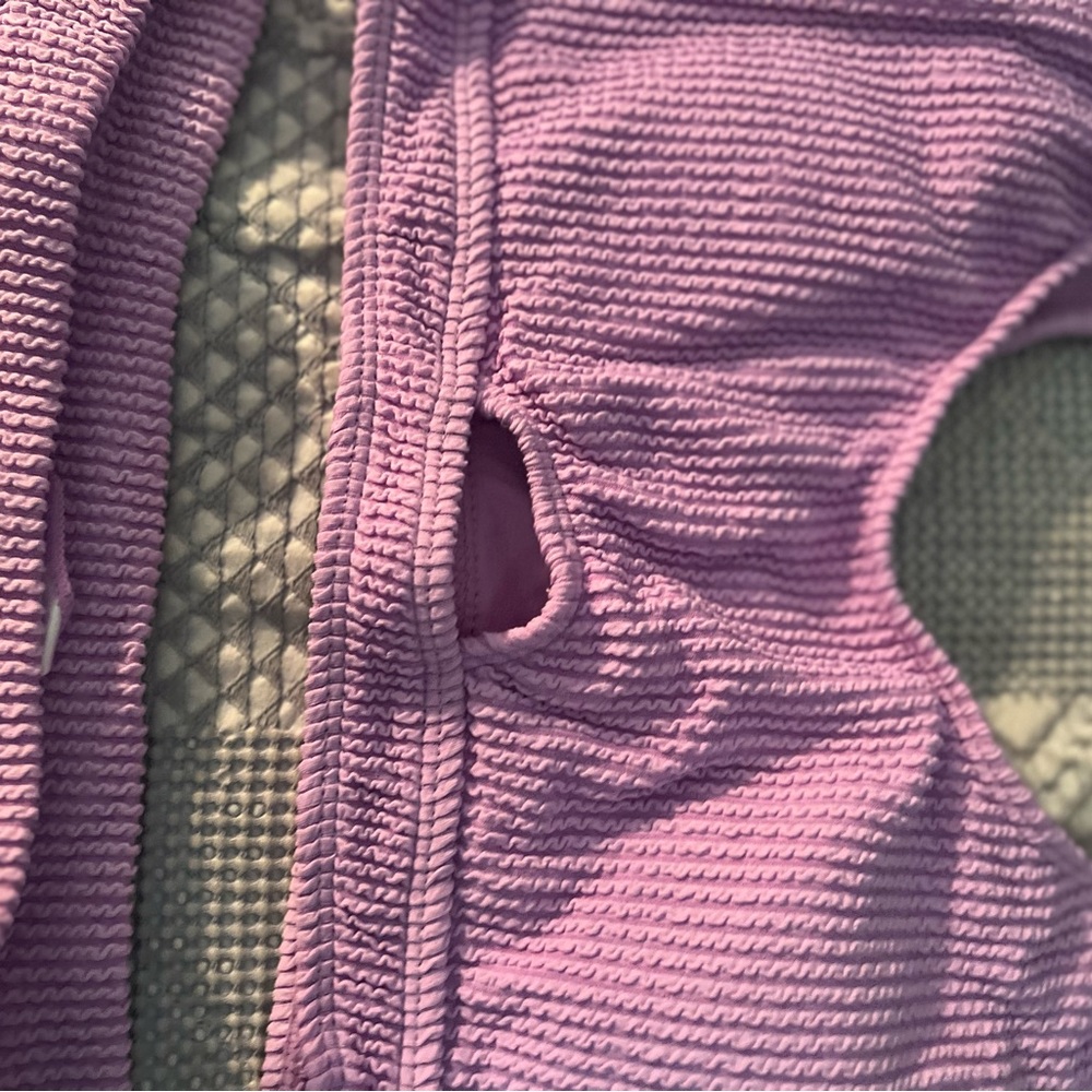 Lilac two piece that has front cutout.